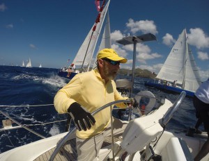 Sag Harbor Yacht Yard owner Lou Grignon at the wheel during Antigua Sailing Week.